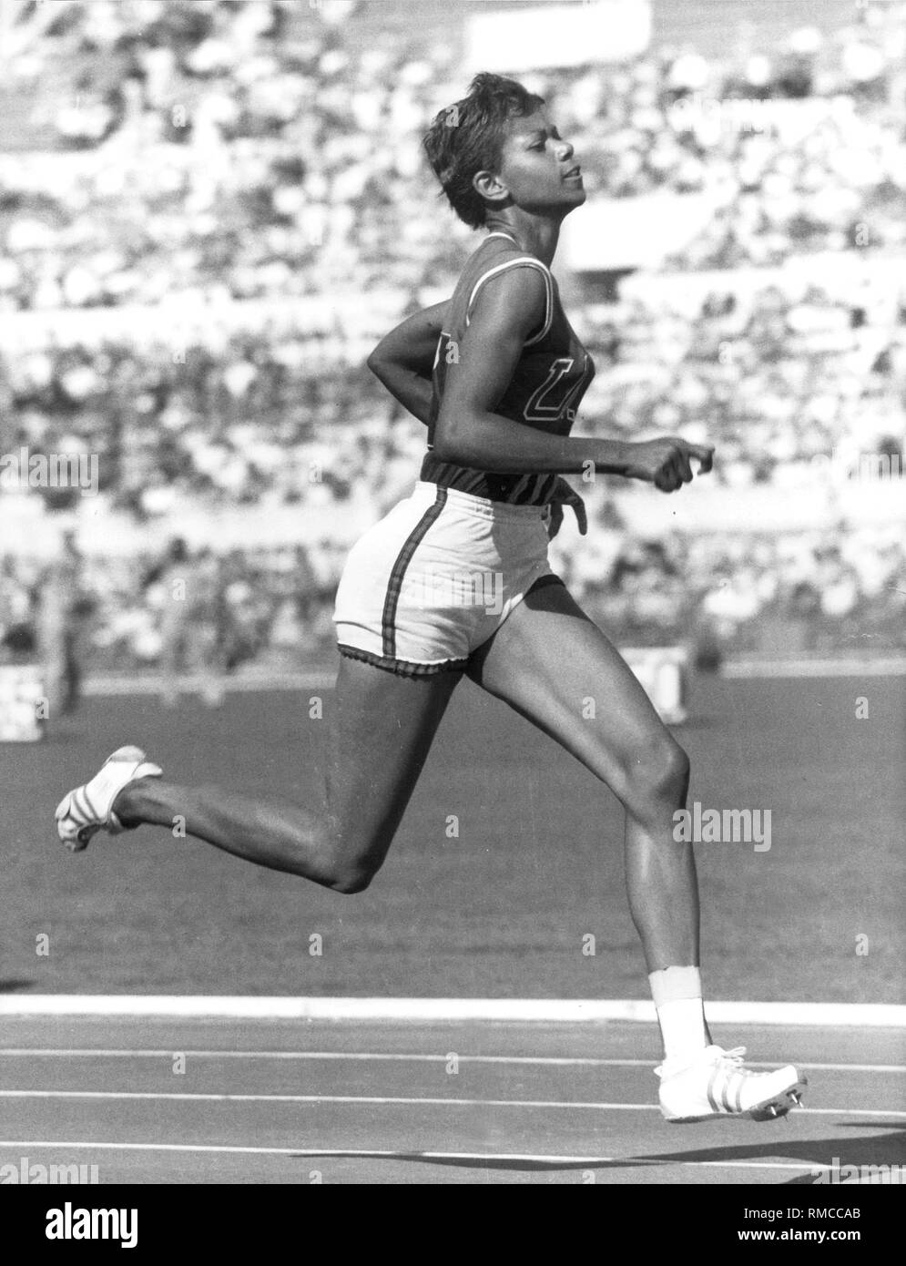 The US athlete Wilma Rudolph at the 1960 Olympic Games in Rome. She won a total of three gold medals in the running competitions in the 100- and 200-meter individual events and the sprint relay. Stock Photo