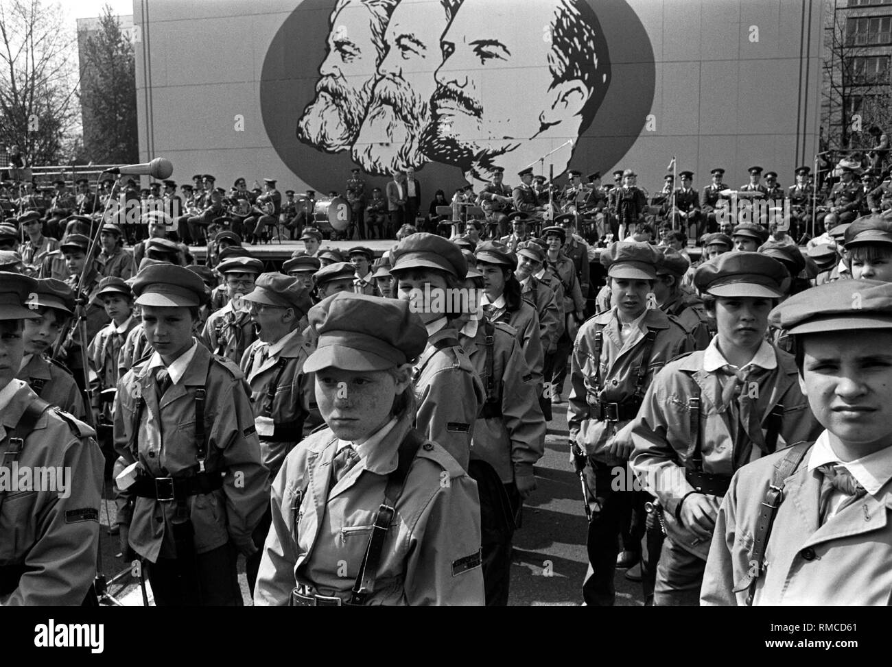 GDR, Berlin, May 1, 1988, May Day protest in the Karl-Marx-Allee, the 'Junge Garde' in front of Marx, Engels, Lenin .... Stock Photo