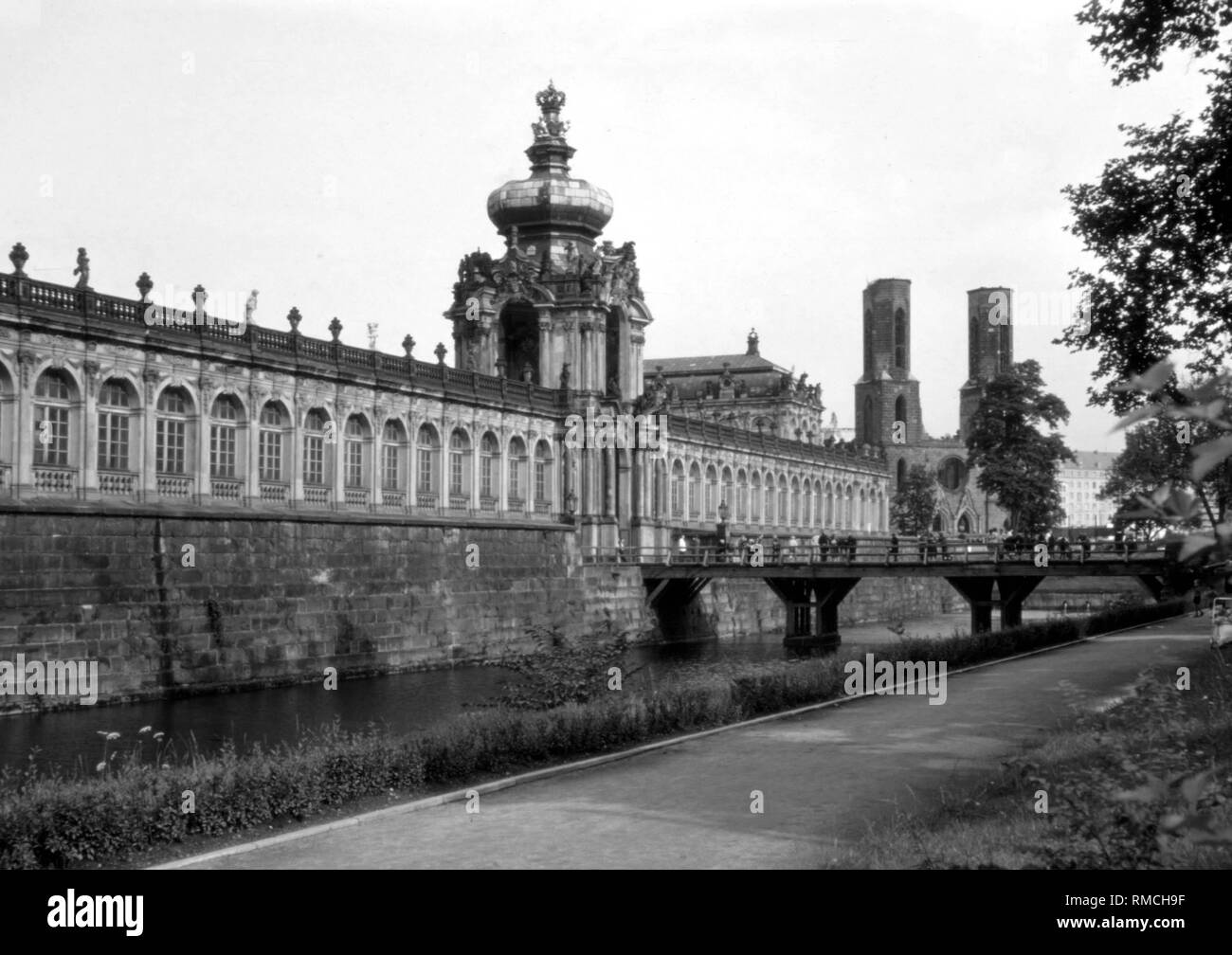 Exterior of the Zwinger with the Kronentor and view of the towers of the ruin of the Sophienkirche destroyed by an air raid on February 13, 1945, at Postplatz in Dresden, demolished in 1962 on order of the head of SED, Walter Ulbricht. Photo from May 1, 1977. Stock Photo