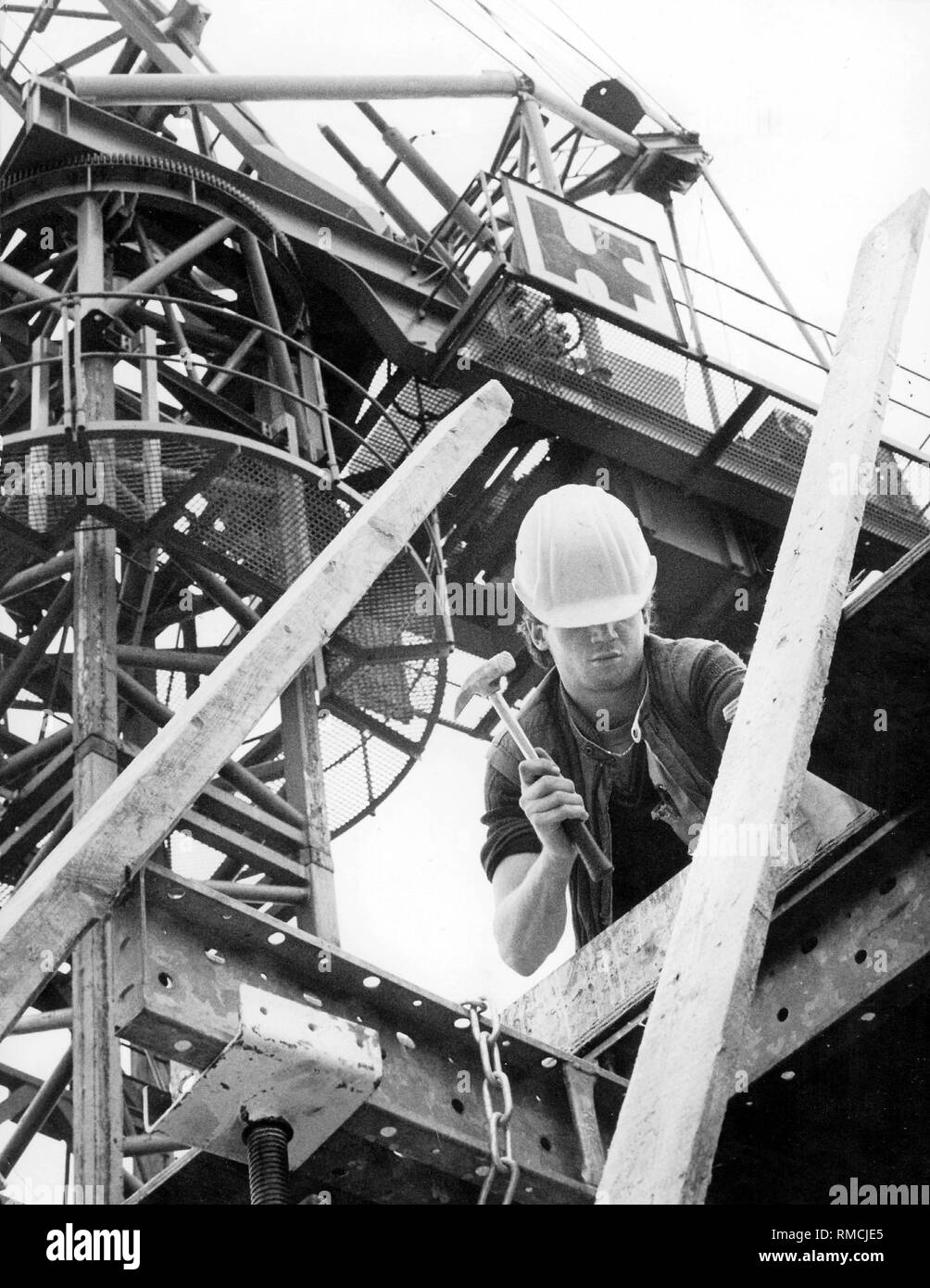 Construction worker at work on a construction site Stock Photo - Alamy