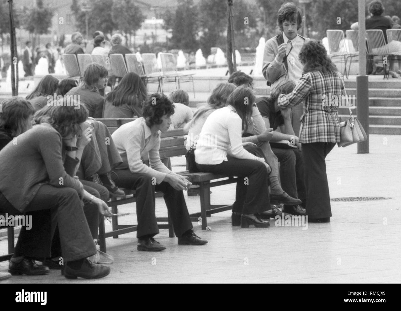 Young people in front of the Fernsehturm at Alexanderplatz in East Berlin. Photo from March 1, 1969. Stock Photo