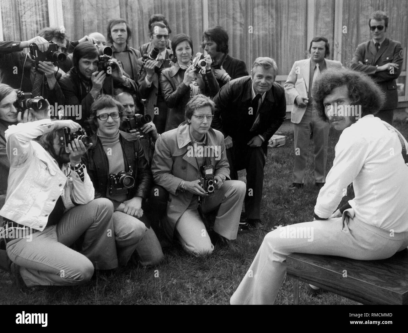 Paul Breitner is surrounded by photographers, before the match of the Germans against the Scottish national team in Frankfurt. Stock Photo