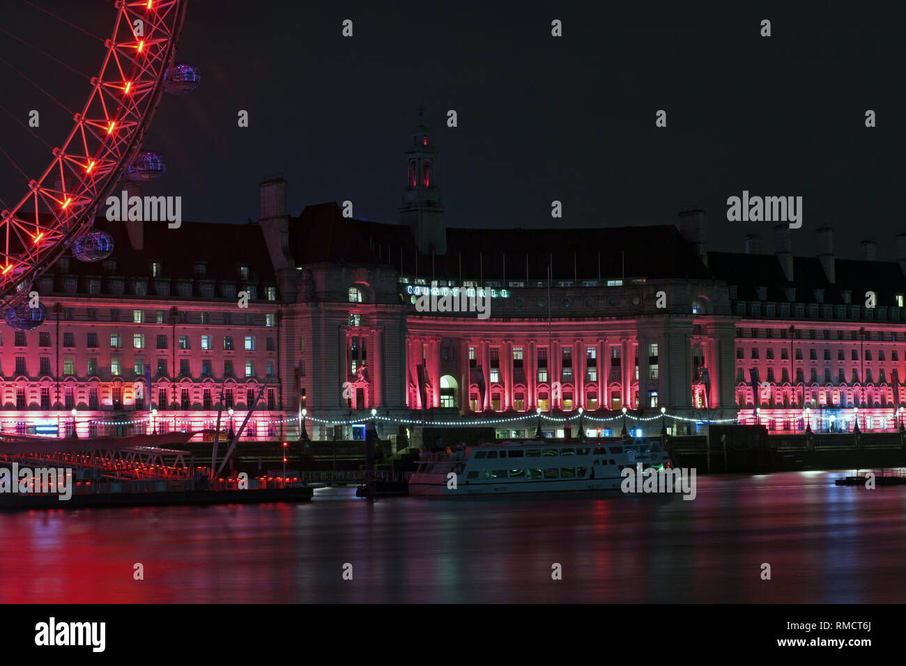 County Hall Building & London Eye by night Stock Photo - Alamy