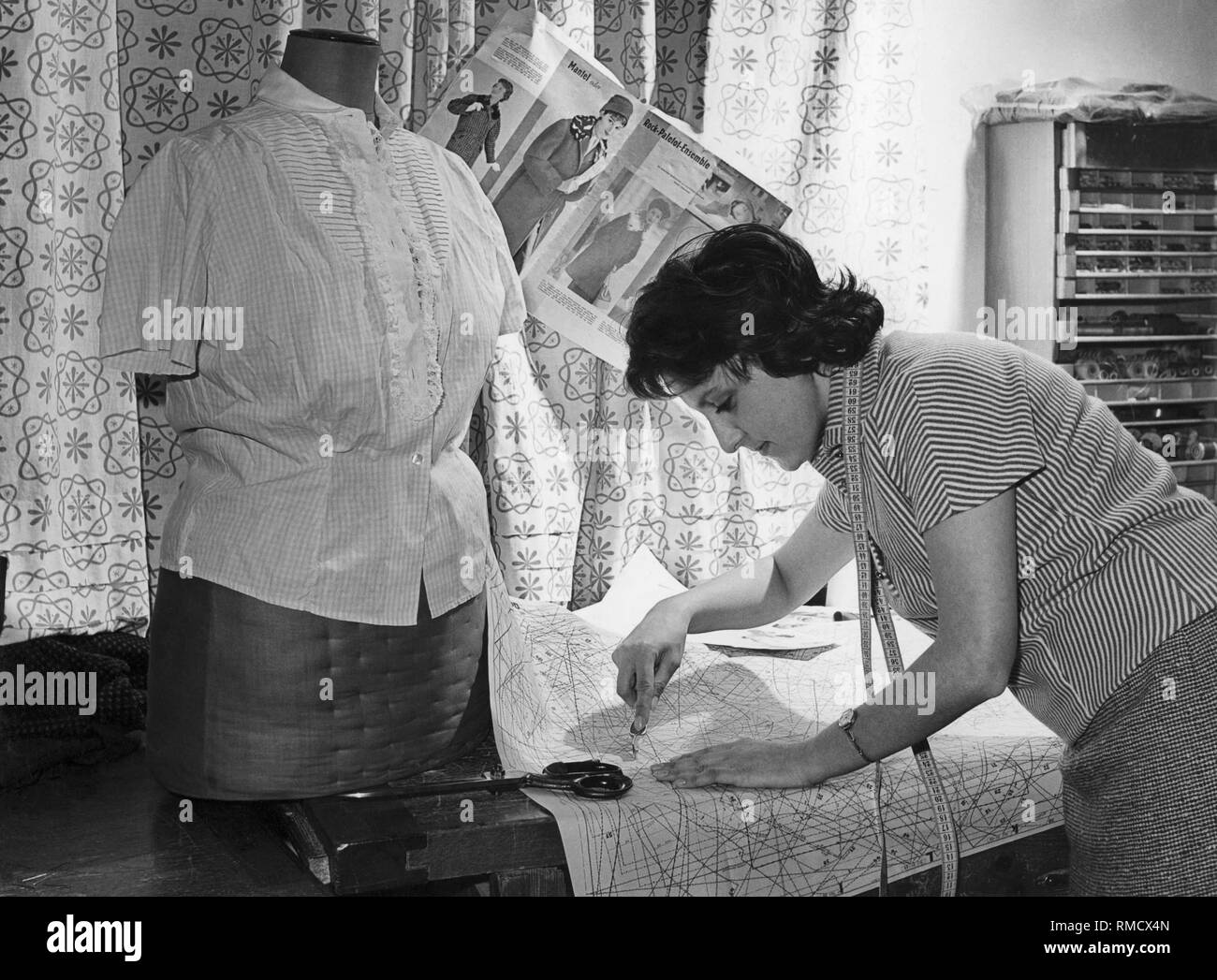 Seamstress at work, 50s Stock Photo Alamy