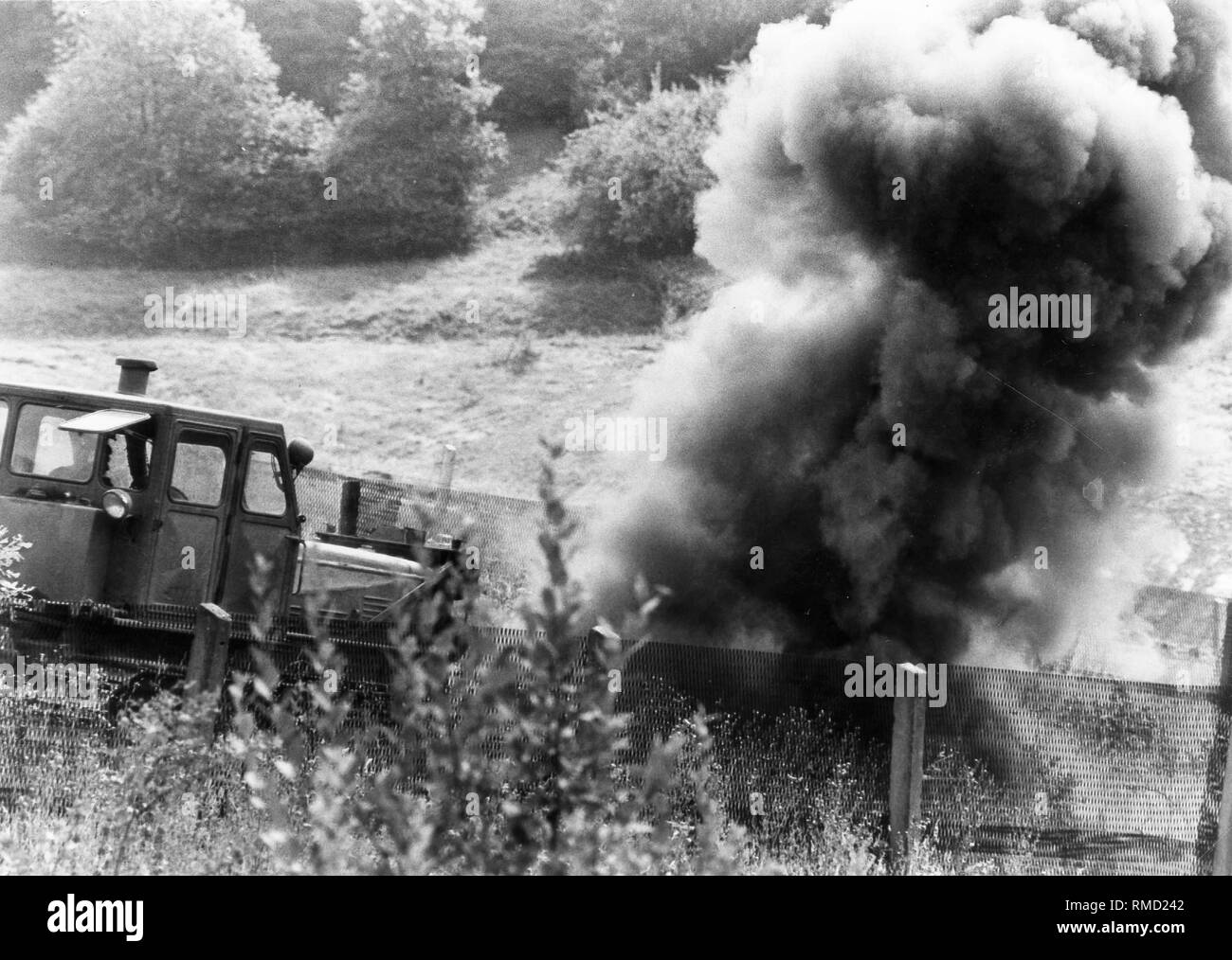 One of the mines explodes during the clearance of anti-personnel mines in the death strip on the border in the Eichsfeld. Stock Photo
