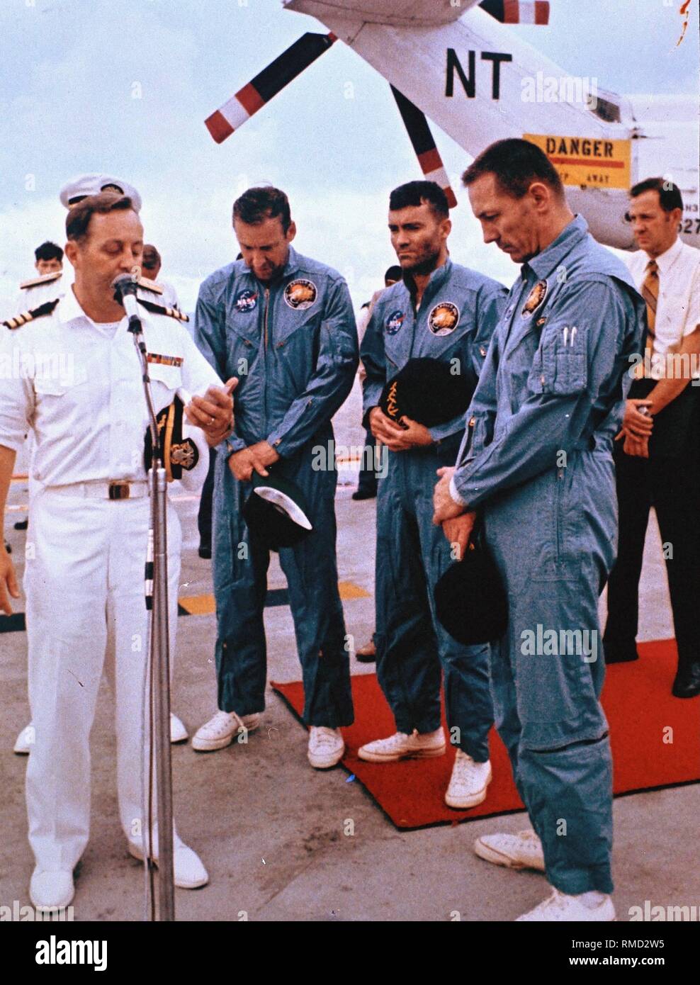 After the landing of Space Capsule 'Odyssey' in the Pacific, the astronauts of the Apollo 13 mission pray aboard the salvage ship, the USS Iwo Jima. Apollo 13 (11-17.04.1970), the third manned Moon landing mission, had to be interrupted exactly before the planned Moon landing due to an explosion in one of the oxygen tanks. After four days of a dramatic rescue operation, the three astronauts were brought back to Earth safely. Stock Photo