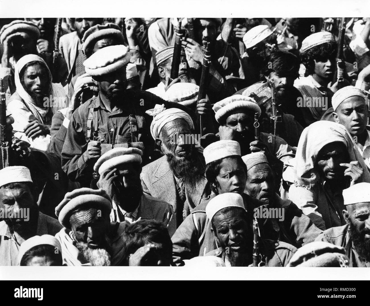 Afghan fighters in a camp on Pakistani territory. The mujahedeen cross the border to rest in Pakistani camps and equip for the fight against Soviet troops. In the refugee camps further volunteers are being recruited. Stock Photo