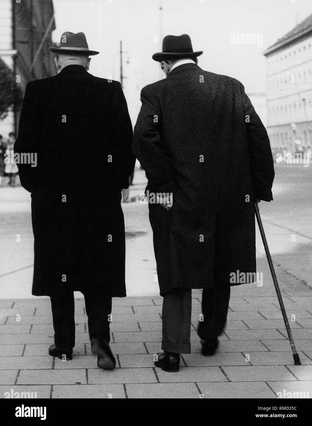 Old men walk Black and White Stock Photos & Images - Alamy