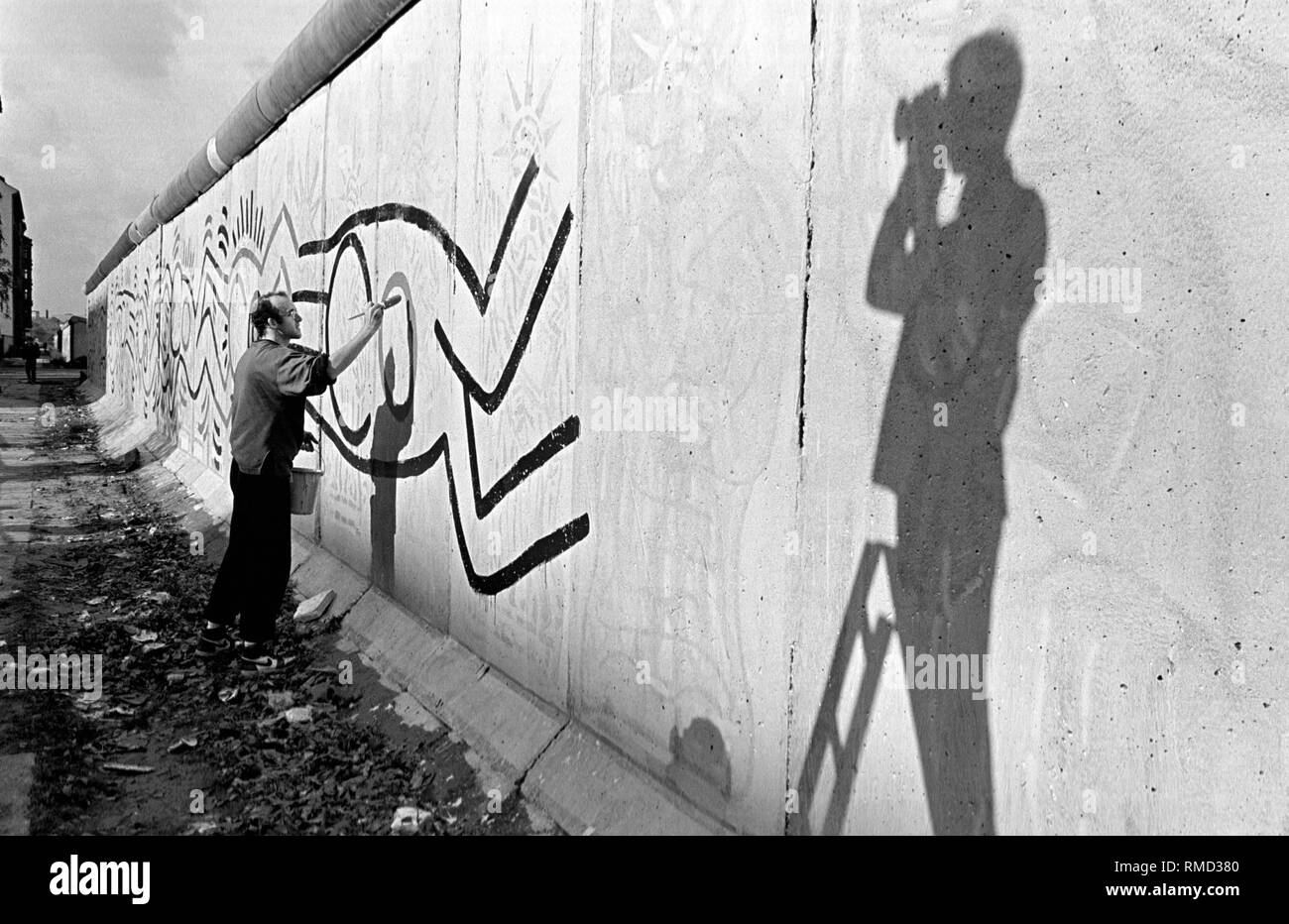 The American artist Keith Haring painted 100m of the Berlin Wall near the  border crossing Ckeckpoint Charlie in the district of Kreuzberg Stock Photo  - Alamy