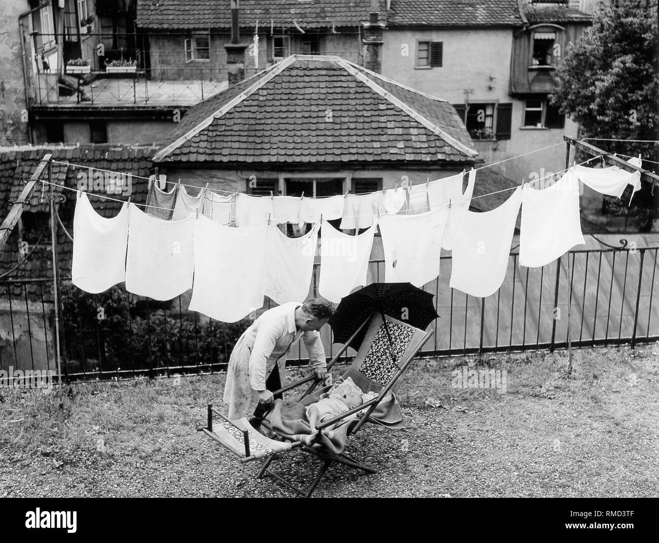 Toddler clothes line Black and White Stock Photos & Images - Alamy