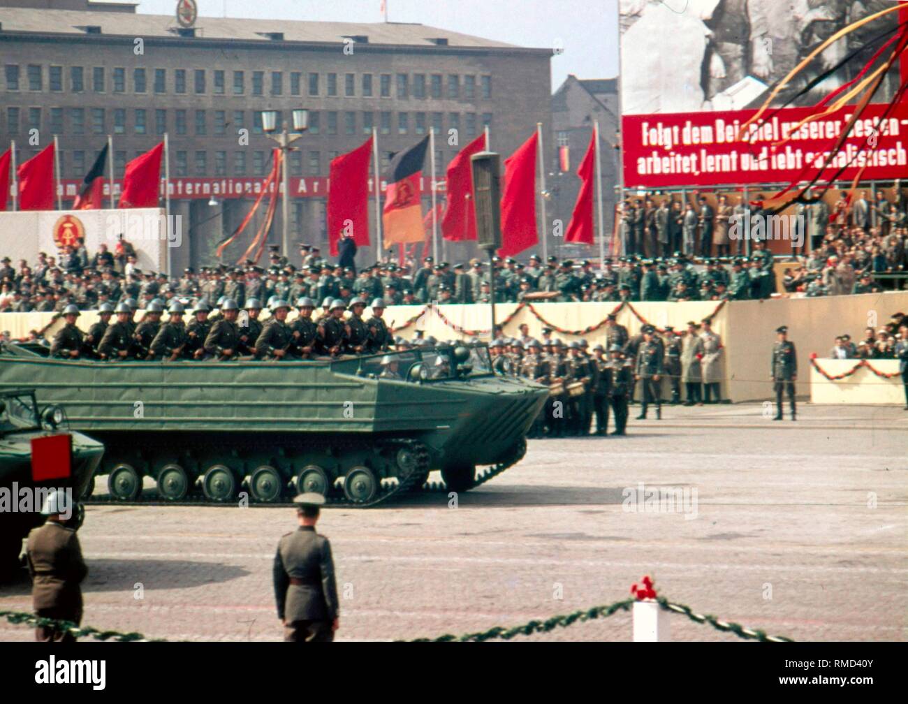 Armored vehicle with soldiers of the GDR People's Army at the military parade on May 1, 1959 on the Marx-Engels-Platz in East Berlin, in the background the house of the SED Central Committee at Werderscher Markt. Stock Photo