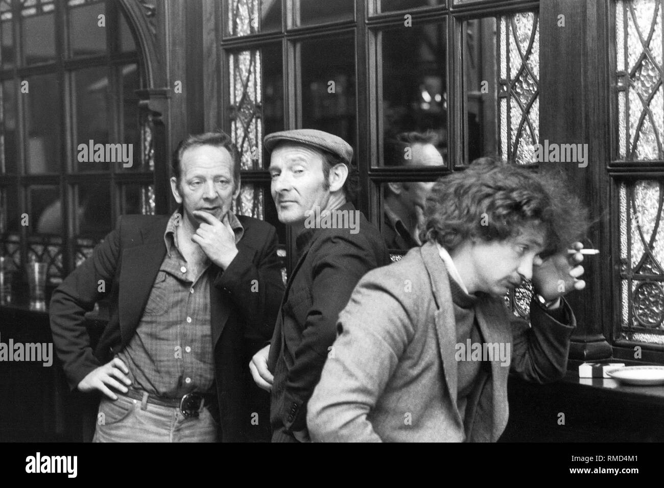 Three Irishmen in a pub. Stock Photo