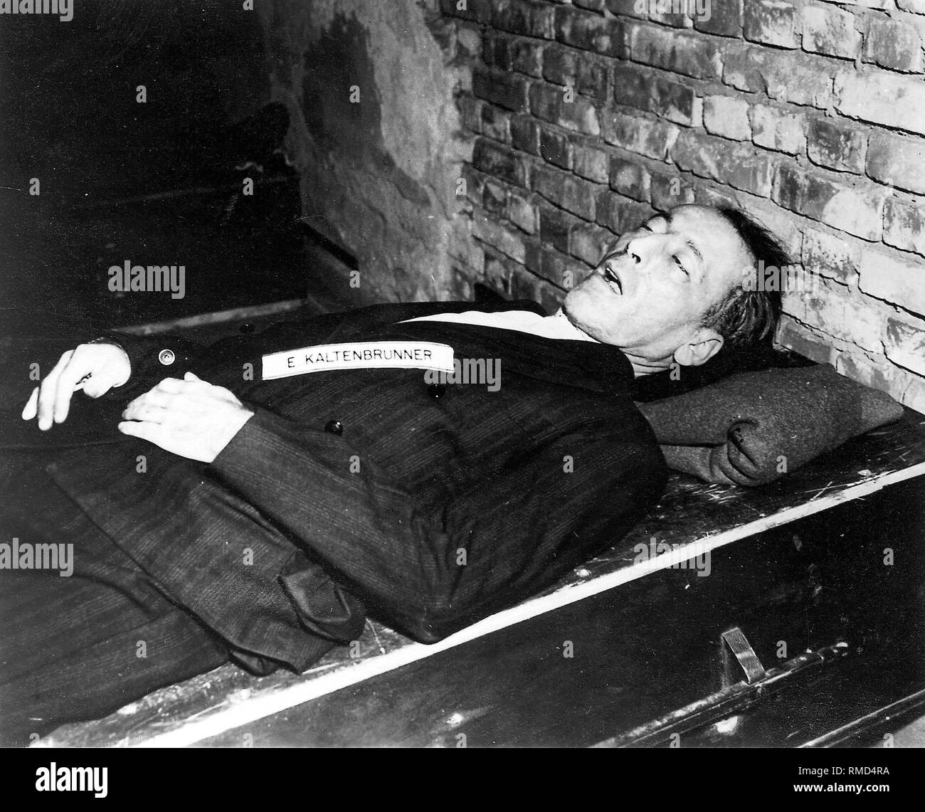 SS Obergruppenfuehrer Ernst Kaltenbrunner after his execution by hanging on October 16, 1946 in Nuremberg (Nuremberg trials). Stock Photo