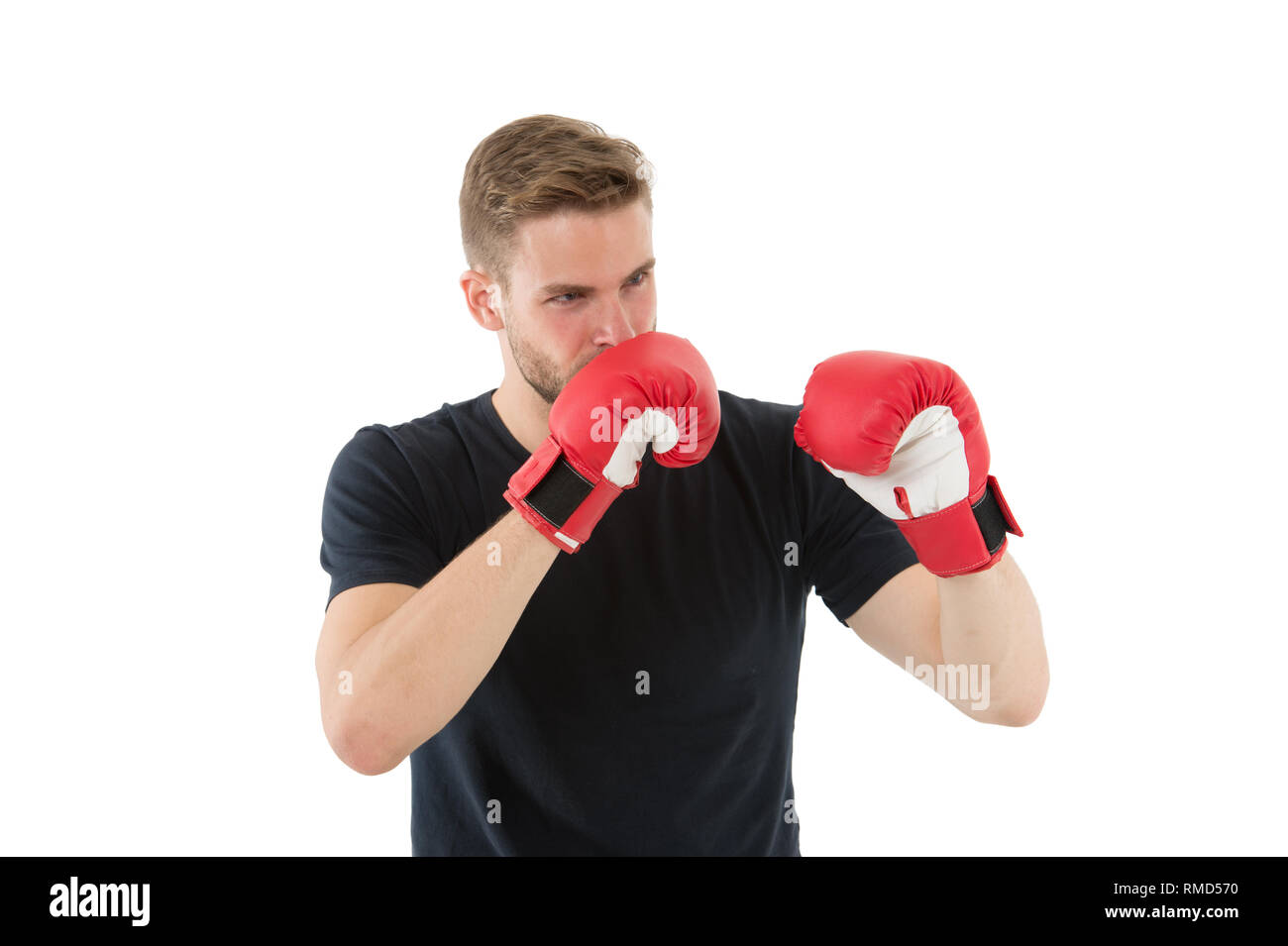 Full concentration. Sportsman concentrated training boxing gloves