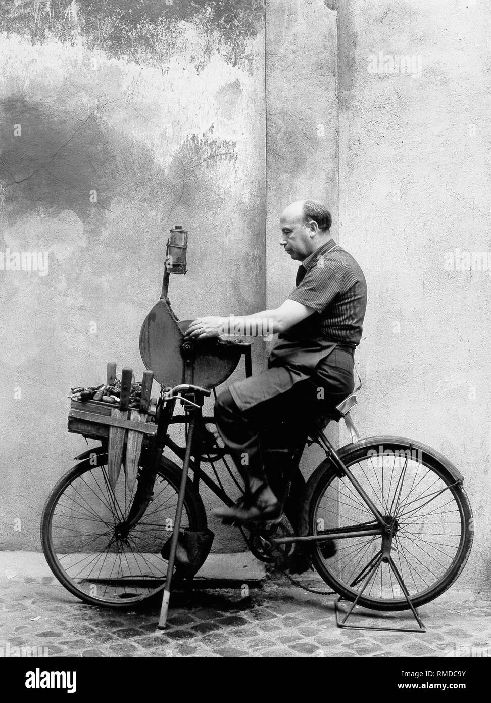 Scissors grinder in Trastevere at work. Stock Photo