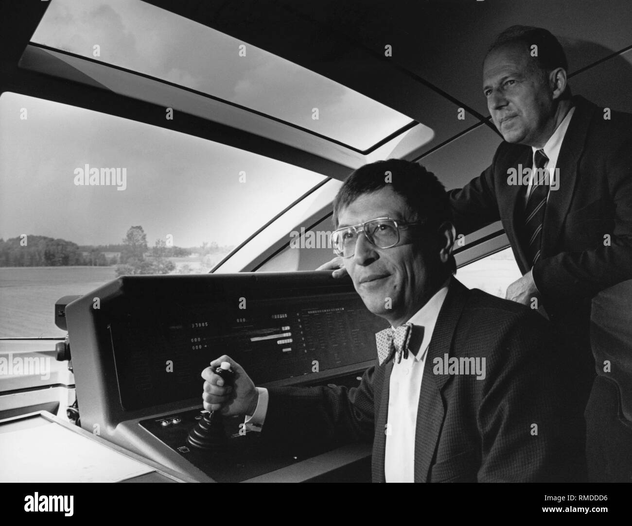 Federal Minister of Transport Juergen Warnke (right) with Federal Minister of Research Heinz Riesenhuber (left) in the driver´s cabin of the high-speed train 'Transrapid'. Stock Photo