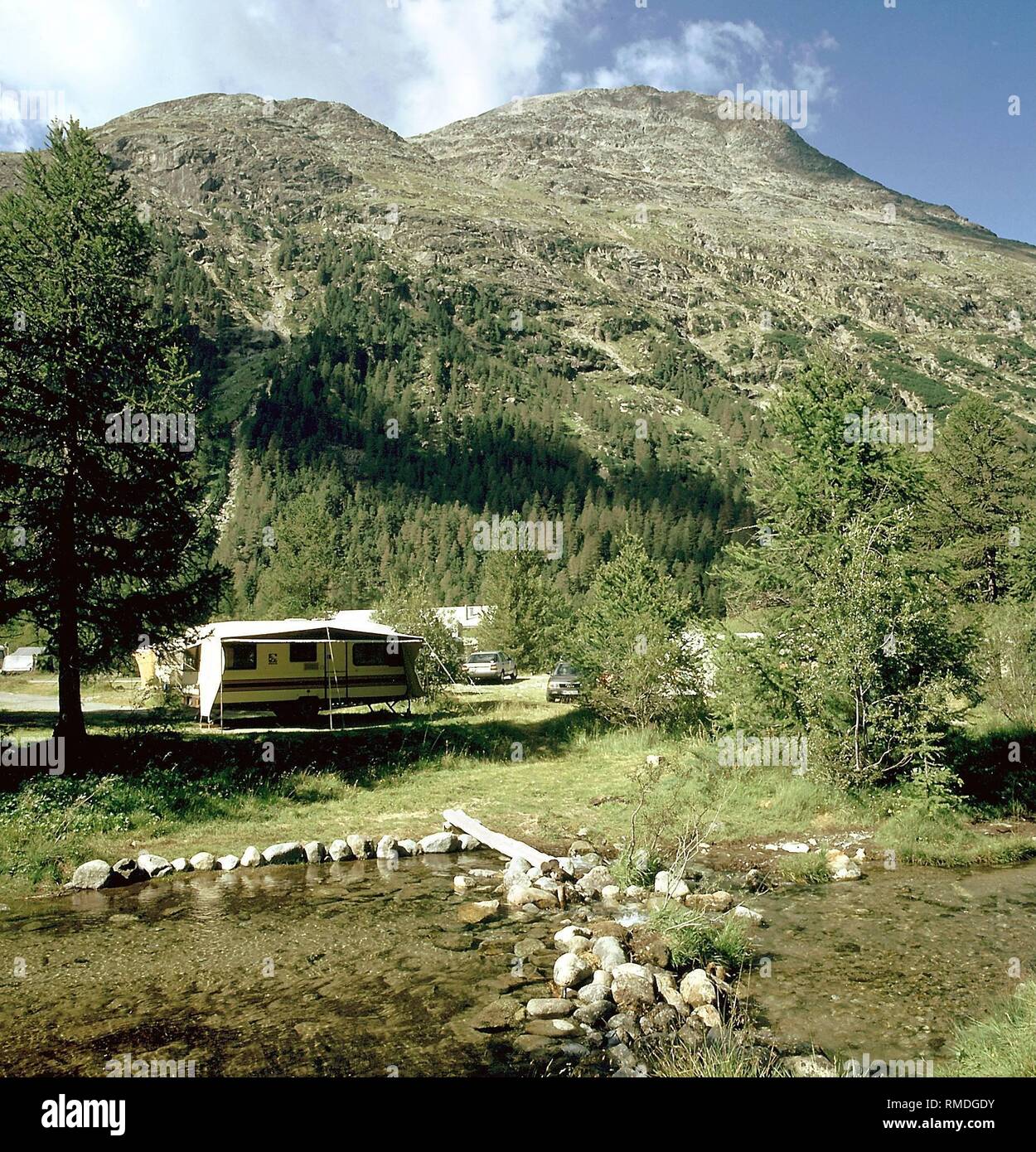 Campsite near Pontresina, at a height of 1850 meters. In the background,  the Pitz Bernina, with its 4049 meters height the highest mountain in  Switzerland Stock Photo - Alamy