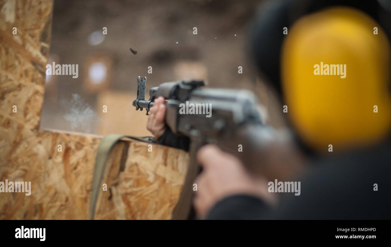 Combat riffle machine gun shooting training from behind and around