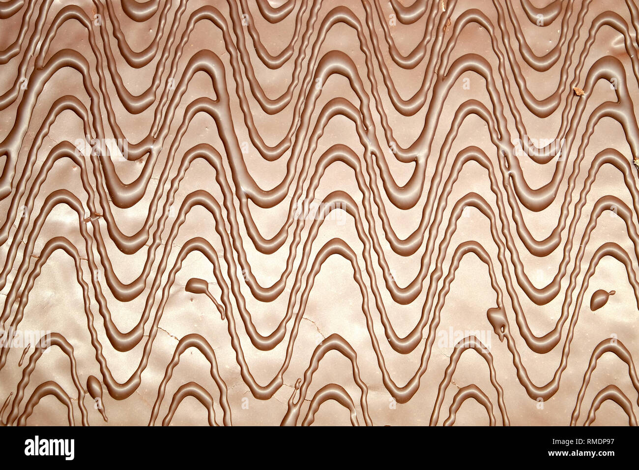 Brown chocolate abstract pattern as background front view horizontal closeup Stock Photo