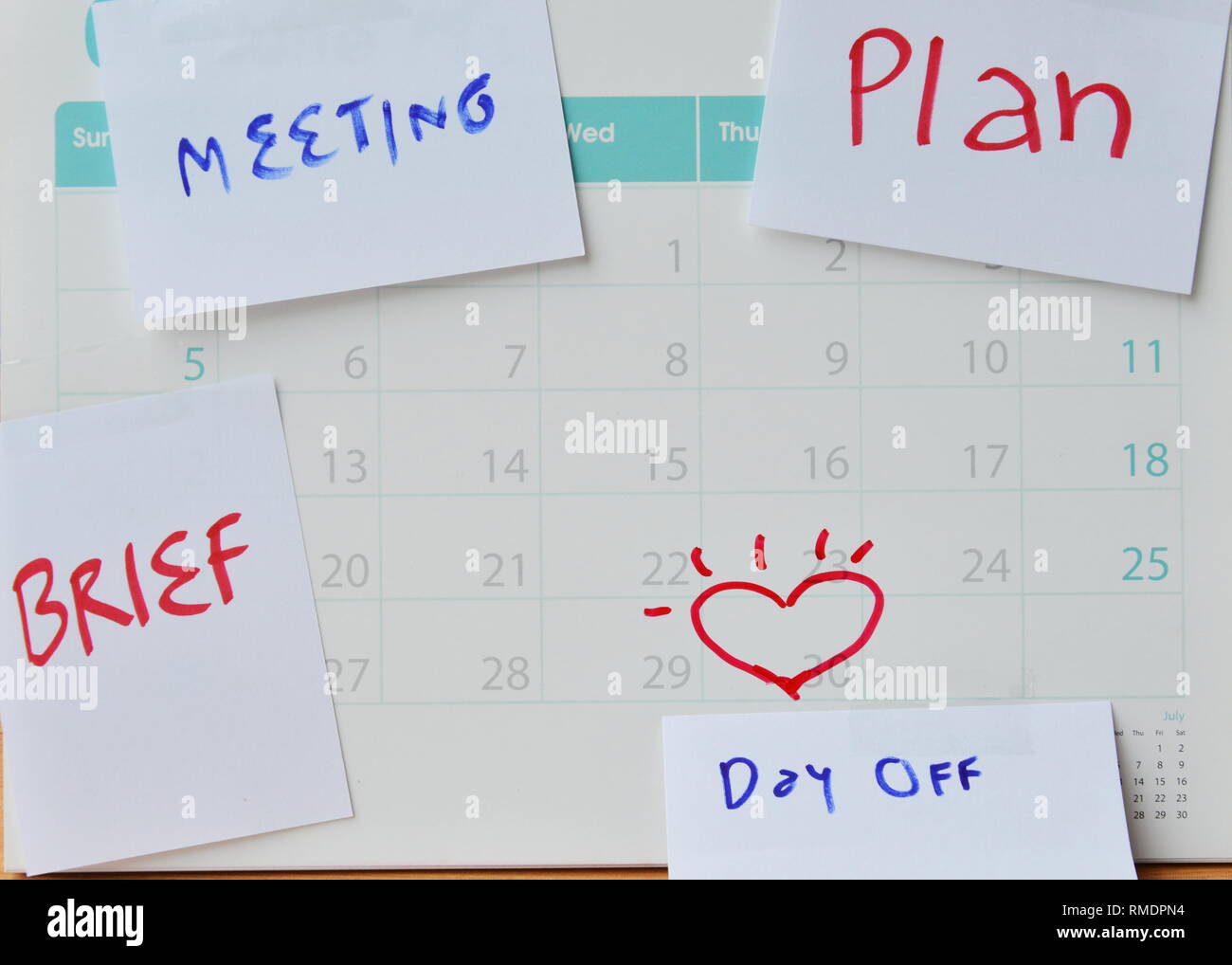 paper note for vacation remind stick on calendar Stock Photo