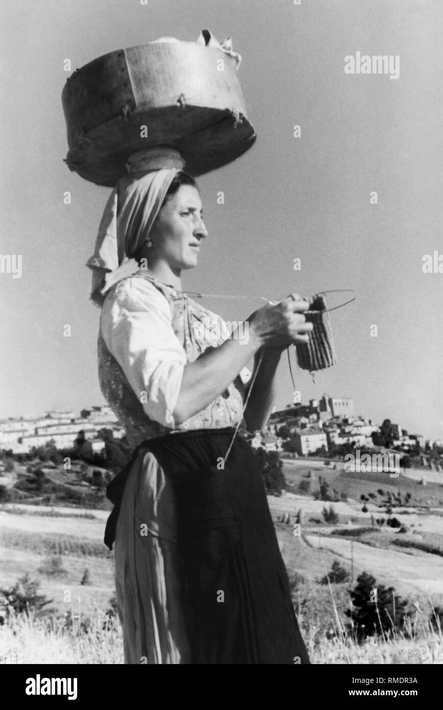 woman working the shirt, molise, italy 1956 Stock Photo