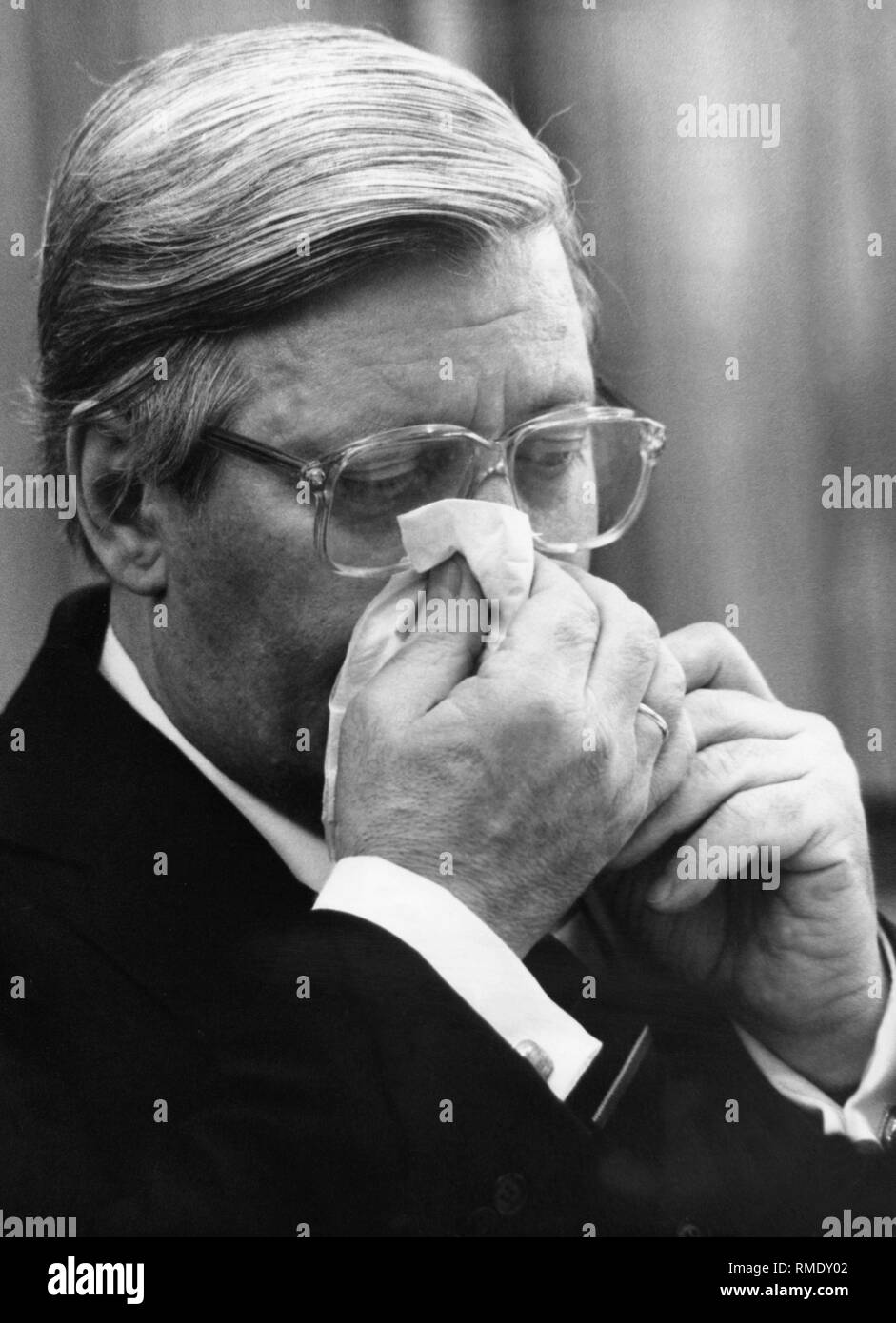 Chancellor Helmut Schmidt blows his nose. Stock Photo