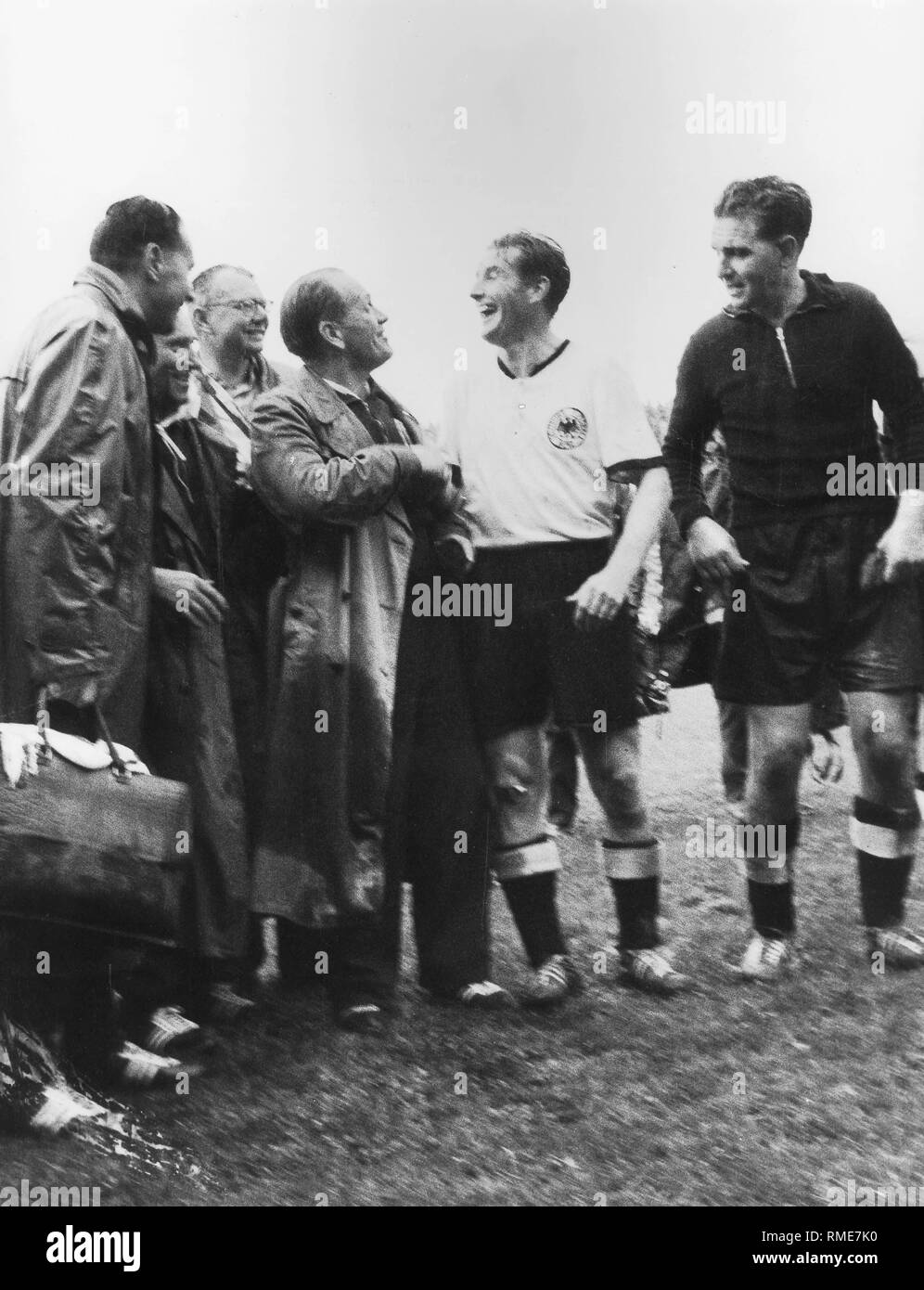 Germany becomes world champion with a 3-2 victory against Hungary. Coach Sepp Herberger congratulates captain Fritz Walter after the final whistle. Stock Photo
