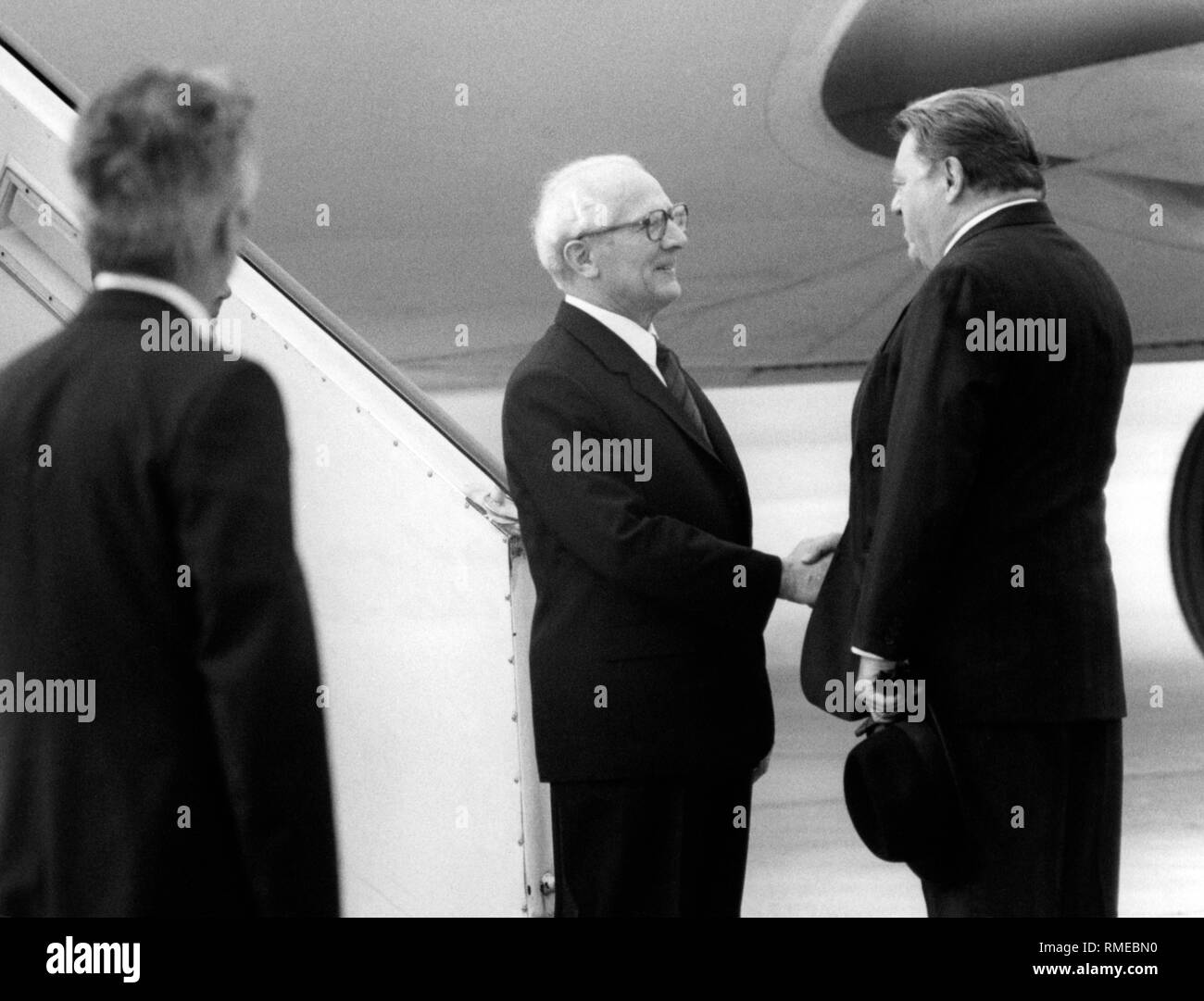 GDR State Council Chairman Erich Honecker is greeted by the Bavarian Prime Minister Franz Joseph Strauss at the airport in Munich-Riem. Stock Photo