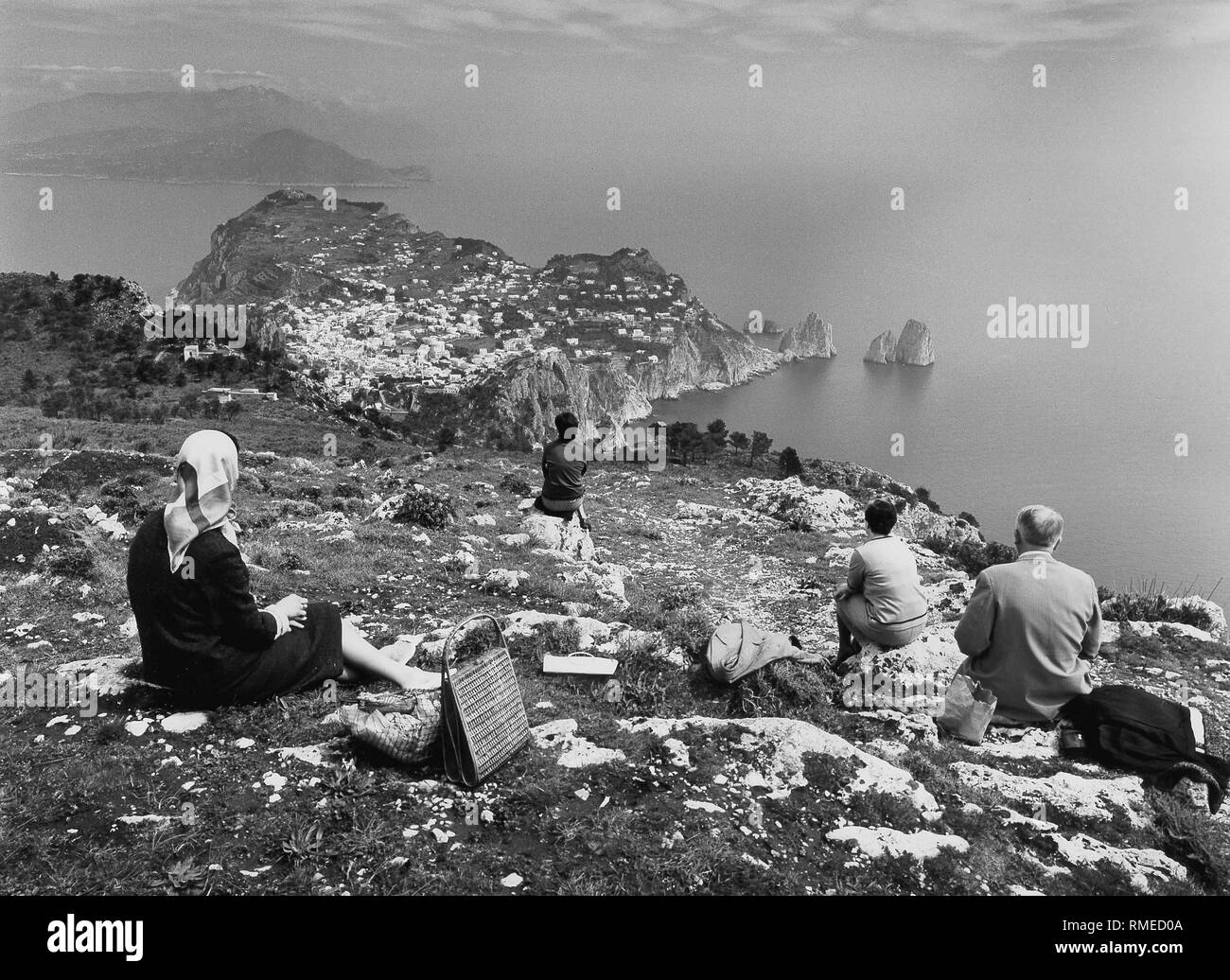Tourists look from Monte Solaro to the city of Capri. Stock Photo