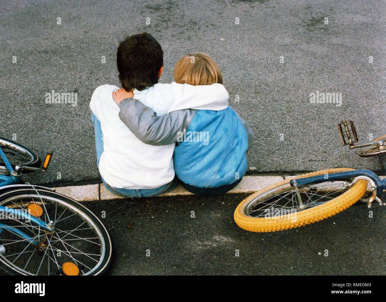 Two children put their arms around each other and symbolize real ...