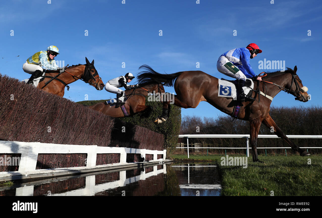 Knockmaole Boy ridden by Hugh Nugent (left), Militarian ridden by James Martin and Eureu Du Boulay ridden by Lielan Woods (right) jump the water jump during The Fernie Steeple Chase at Leicester Racecourse. Stock Photo