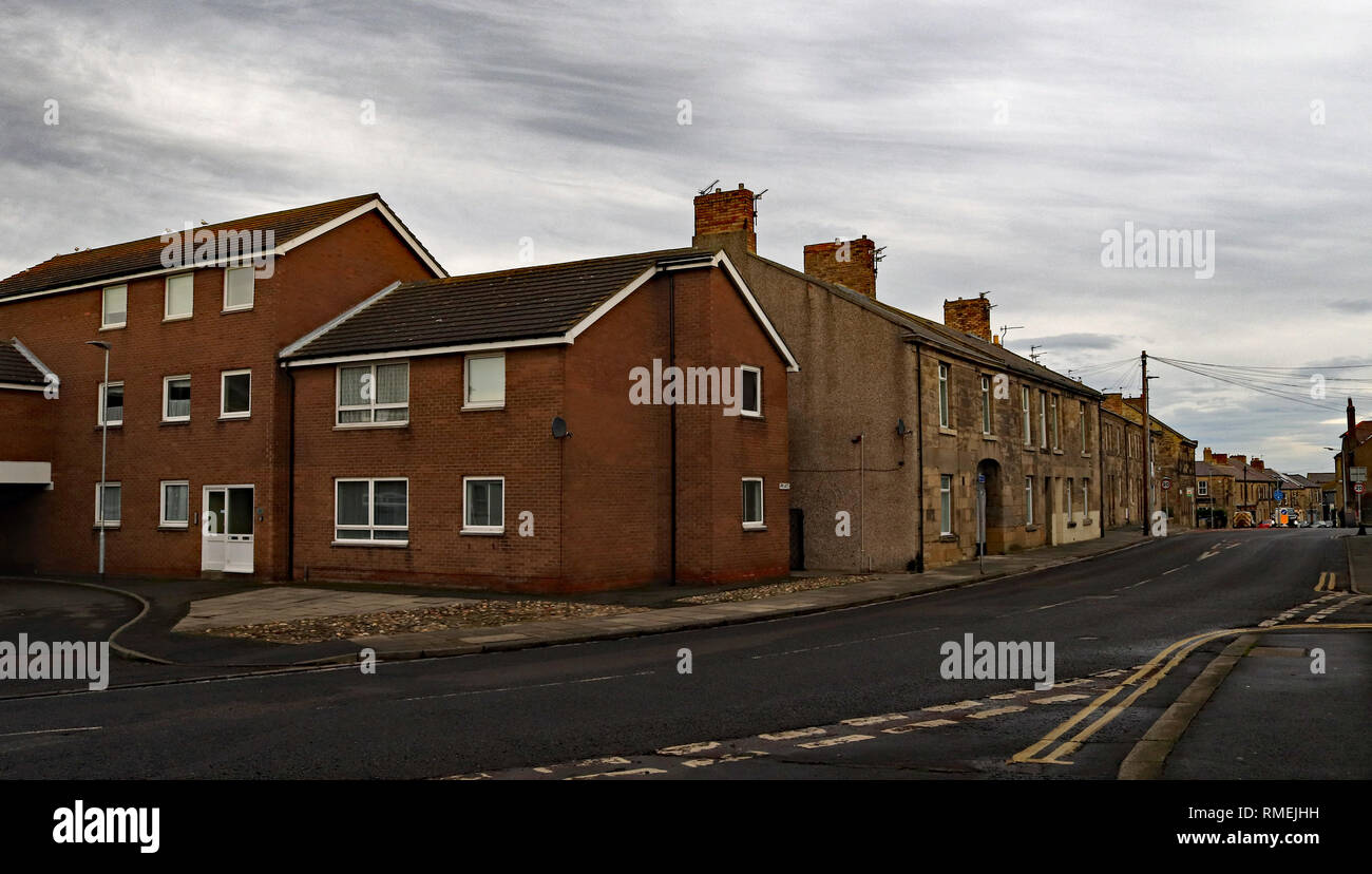 Amble is a small town on the north east coast of Northumberland in North East England. This is the top of the High Street with stone and brick Cw 6611 Stock Photo