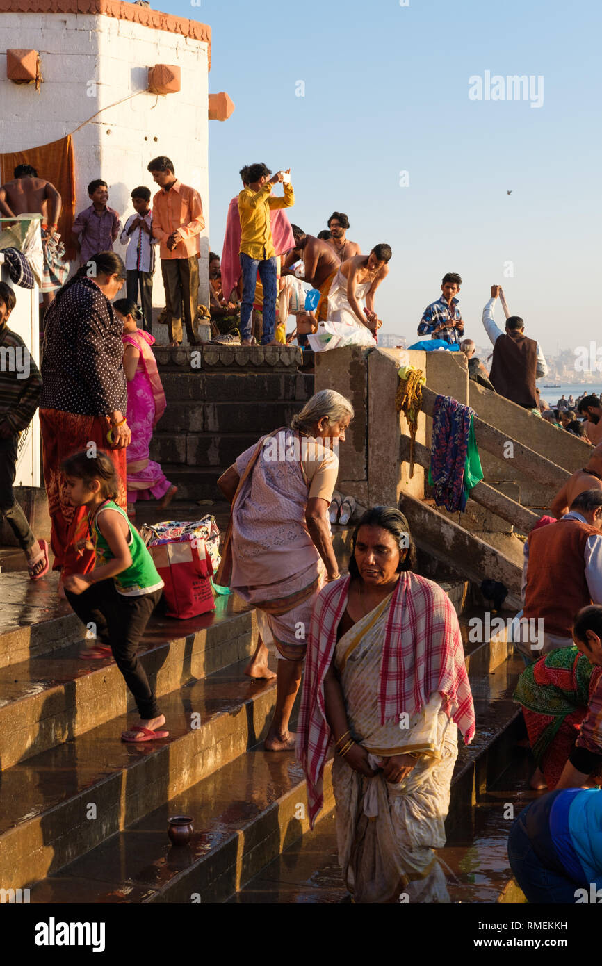 Pilgrims gather on the banks of the Ganges at sunrise in Varanasi, India Stock Photo