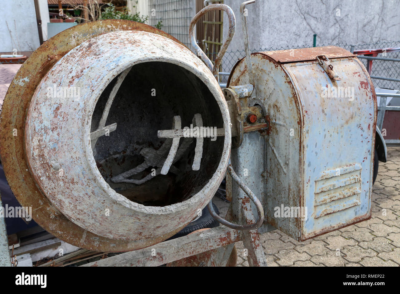 An empty concrete mixer stands on the construction site Stock Photo