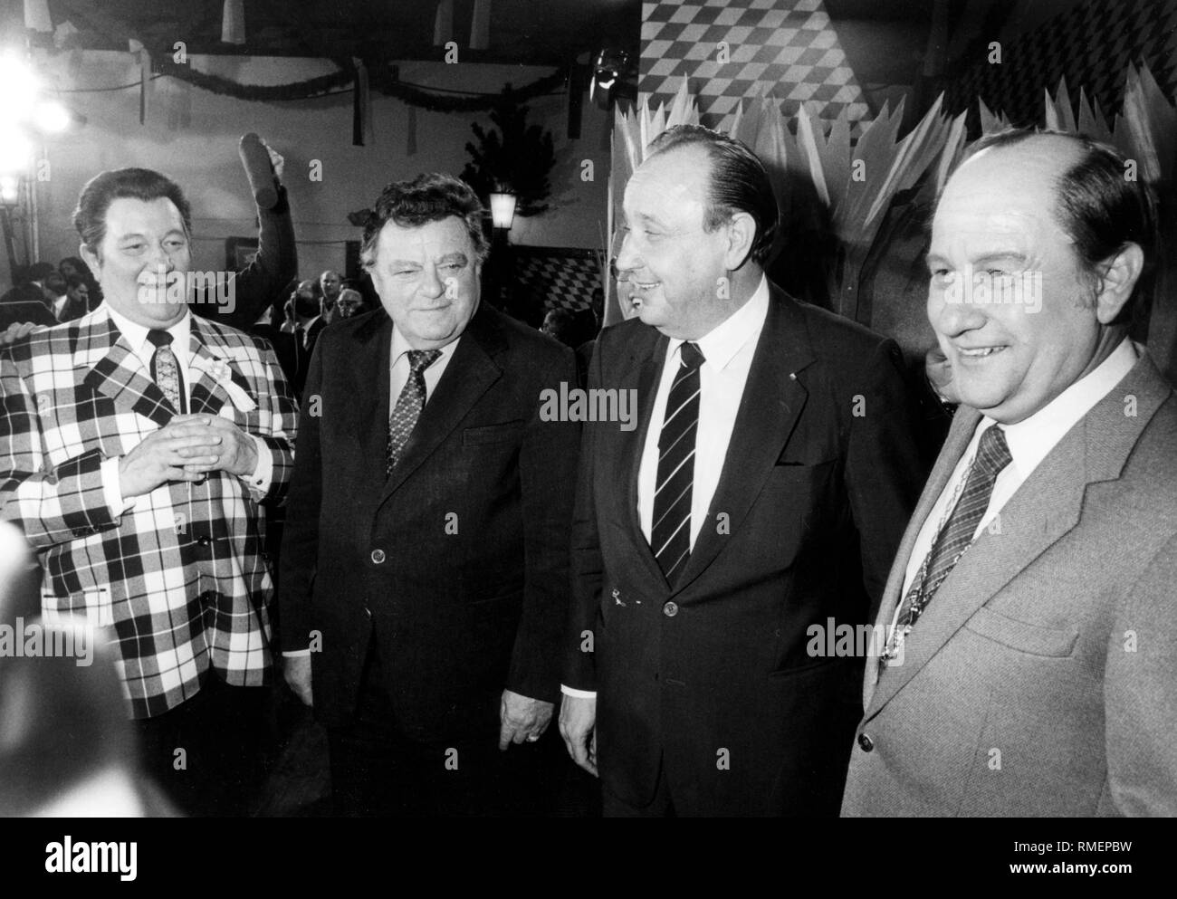 From left to right: Walter Fitz ( as Strauss), Franz Josef Strauss, Hans-Dietrich Genscher and Wastl Fitz (as Genscher) after a light opera at  the Starkbieranstich (strong beer tapping) on the Nockherberg in Munich. Stock Photo