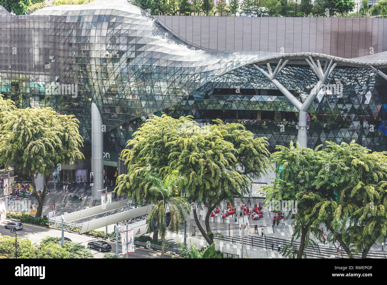 Singapore / Singapore - February 10 2019: Aerial close up view of Ion Orchard shopping mall exterior and Orchard Road street during day time Stock Photo