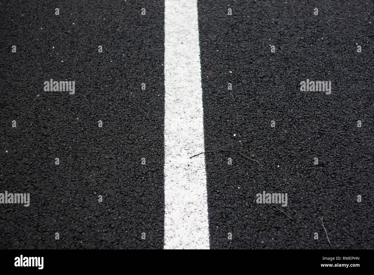 Beautiful black road path view of road with white line in the middle. Stock Photo
