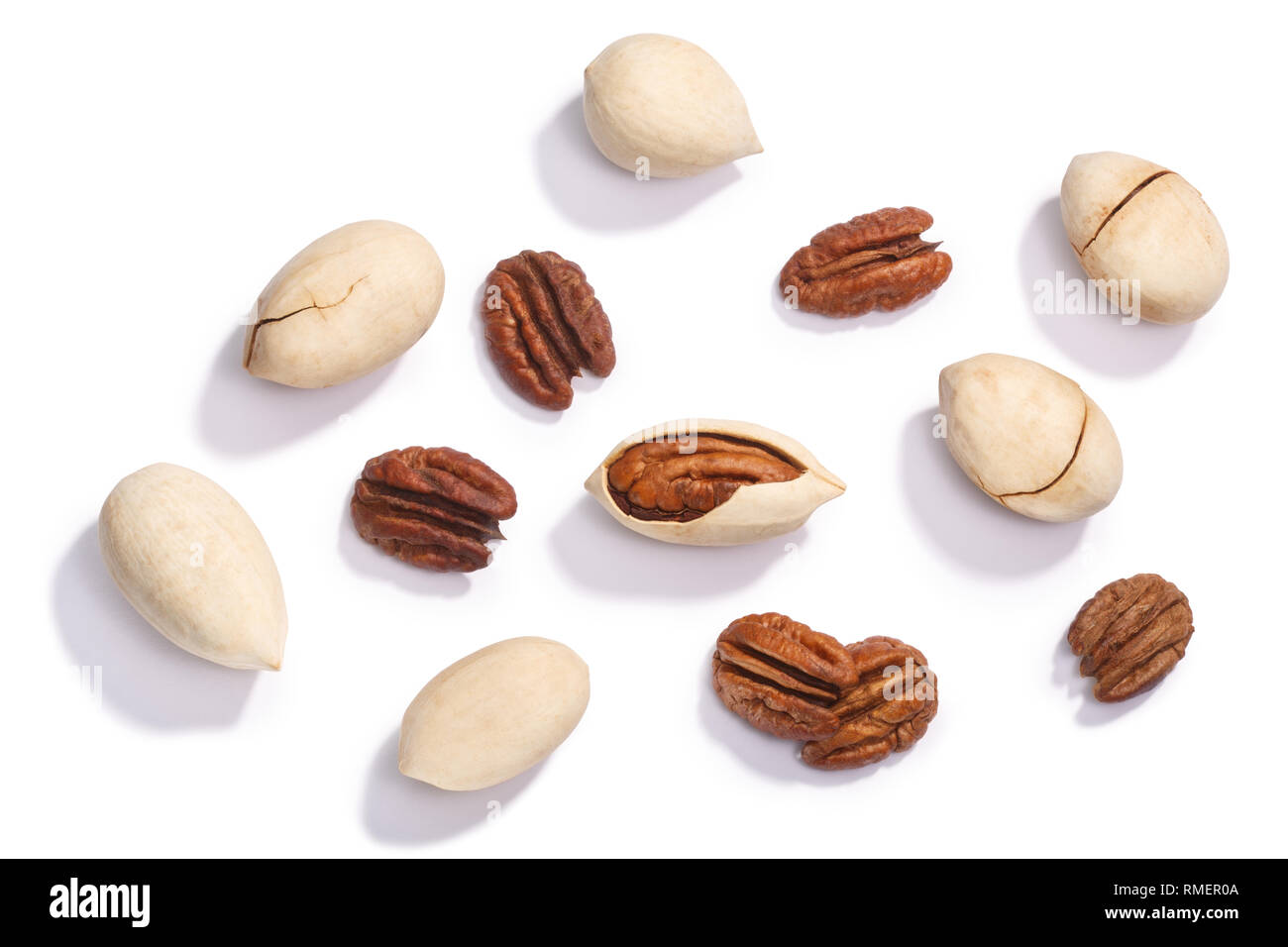 Pecans, whole and shelled, halves (Carya illinoinensis seeds), top view