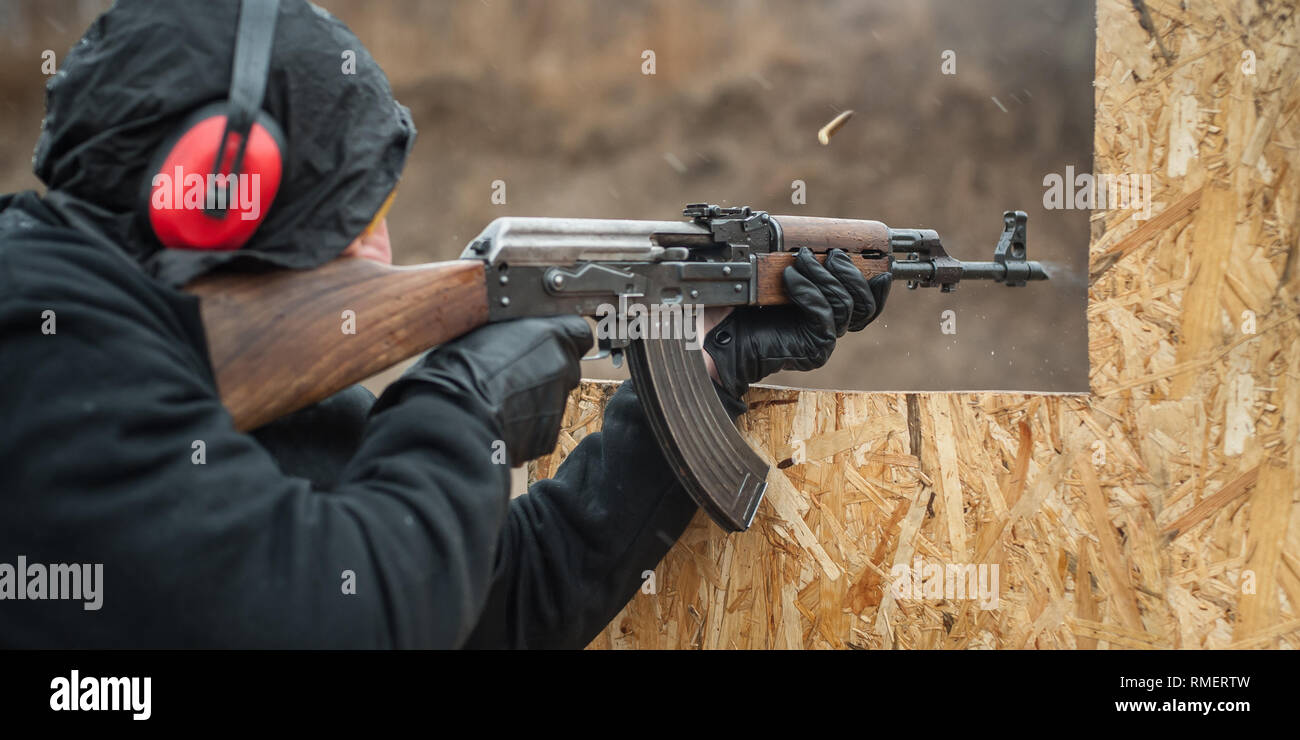 Combat riffle machine gun shooting training from behind and around