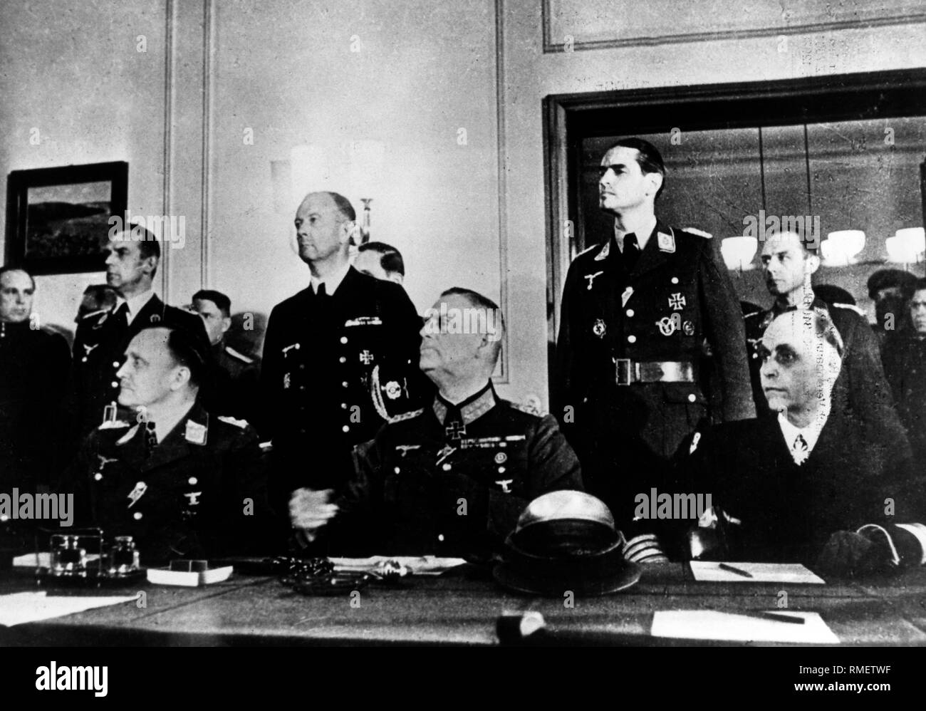 General Hans-Juergen Stumpff, Field Marshal General Wilhelm Keitel and Admiral Hans-Georg von Friedeburg listen to the speech of the Soviet Marshal Schukow during the formal capitulation in Berlin Karlshorst on the 09th of May, 1945. Stock Photo