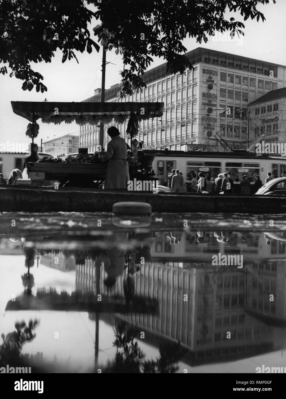Shopping center Kaufhof in Munich and in front reflection on the water. Stock Photo
