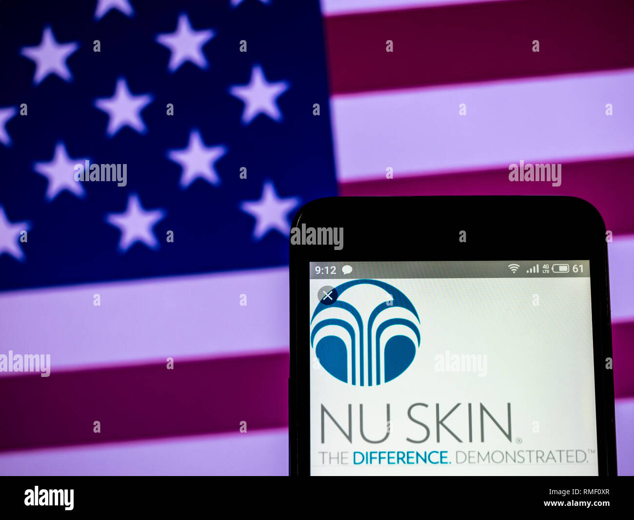 Nu Skin Enterprises company  logo seen displayed on smart phone Stock Photo