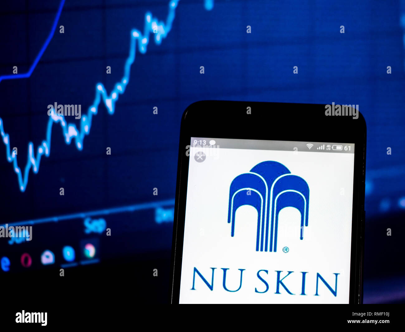 Nu Skin Enterprises company  logo seen displayed on smart phone Stock Photo