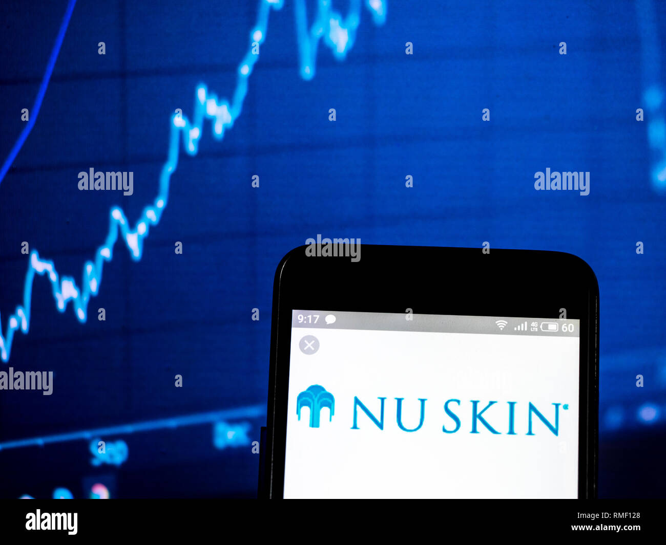 Nu Skin Enterprises company  logo seen displayed on smart phone Stock Photo