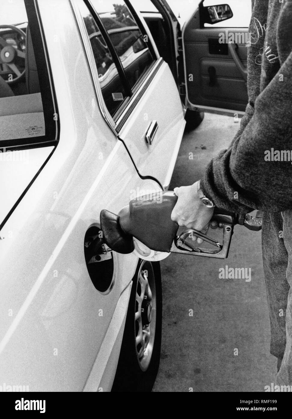 Fuel nozzle with gas recirculation. It should aspirate carcinogenic benzene vapors during refueling. Stock Photo