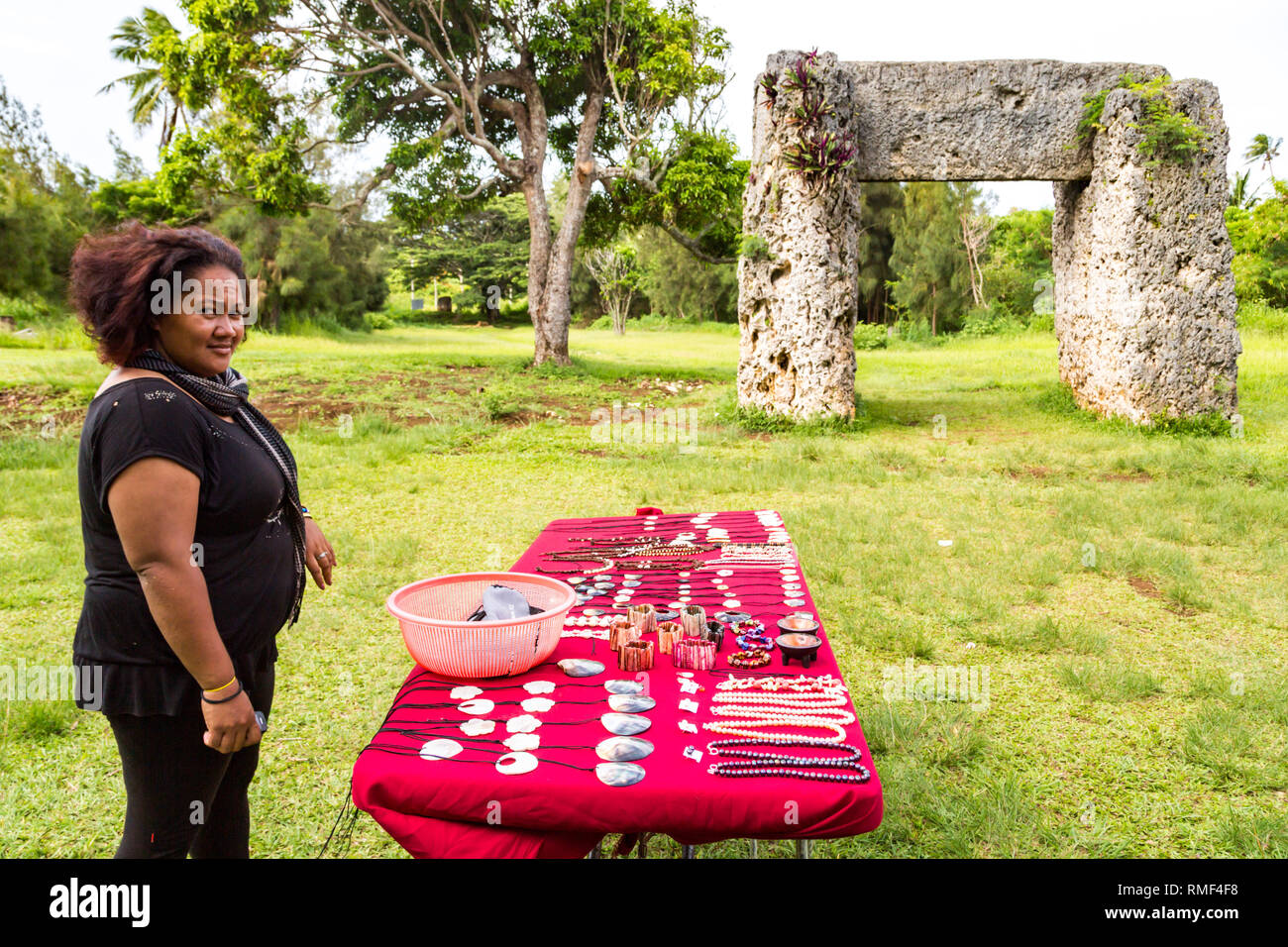 Tongatapu, Tonga - Jan 10 2014: A vendor is selling souvenirs to tourists at Haamonga a Maui, Ha'amonga 'a Maui, or Burden of Maui site, a stone trili Stock Photo