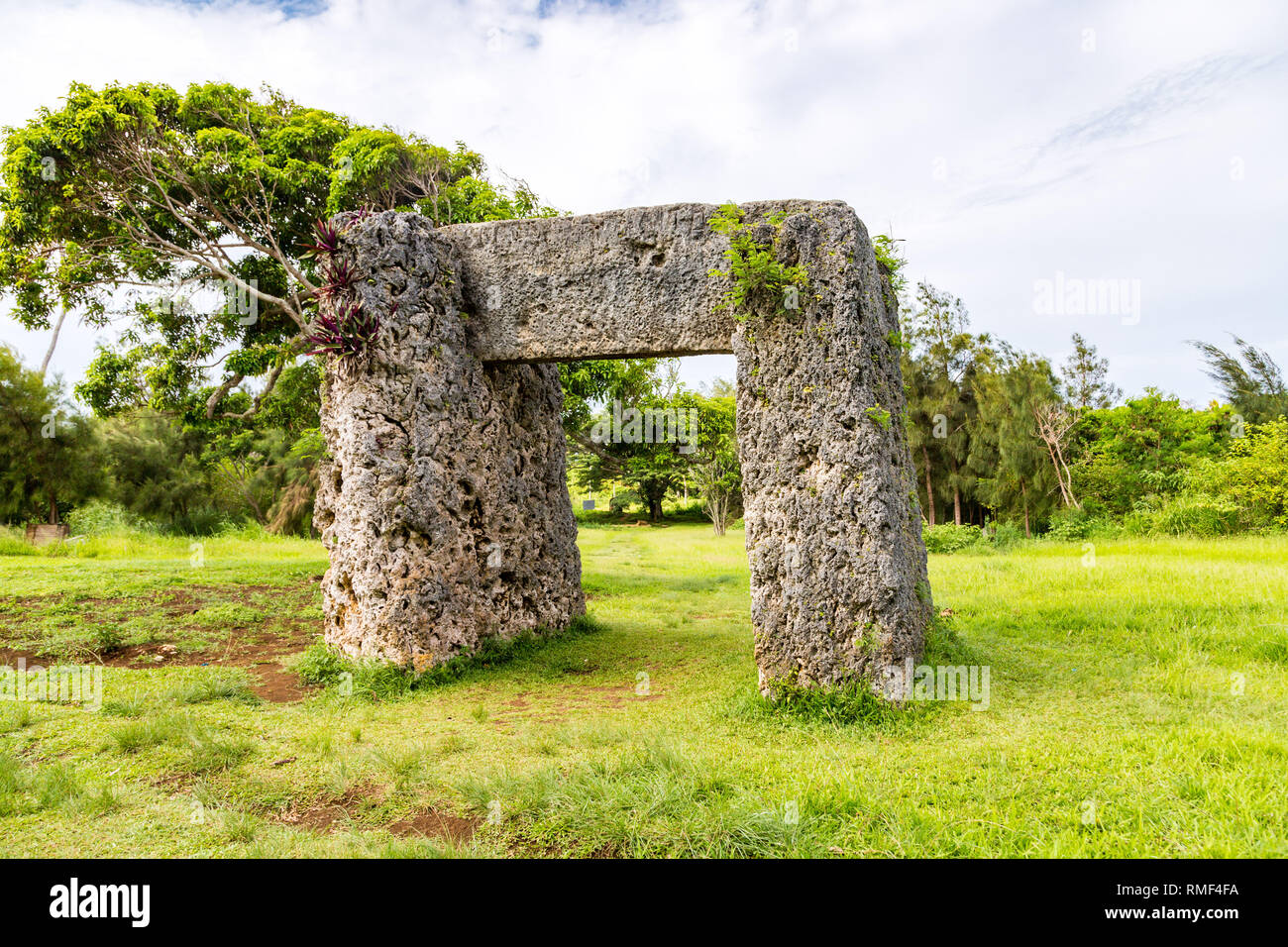 Haamonga a Maui, Ha'amonga 'a Maui or Burden of Maui, stone trilithon in the Kingdom of Tonga, overgrown in jungle, Tongatapu island, Niutoua village, Stock Photo