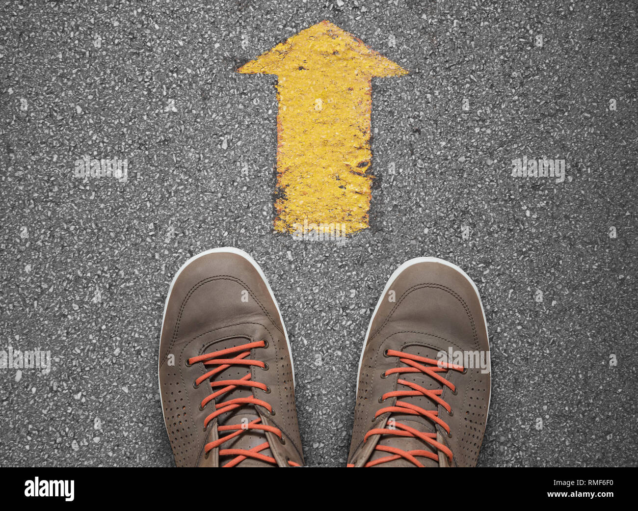 yellow arrow pointing ahead, direction concept Stock Photo