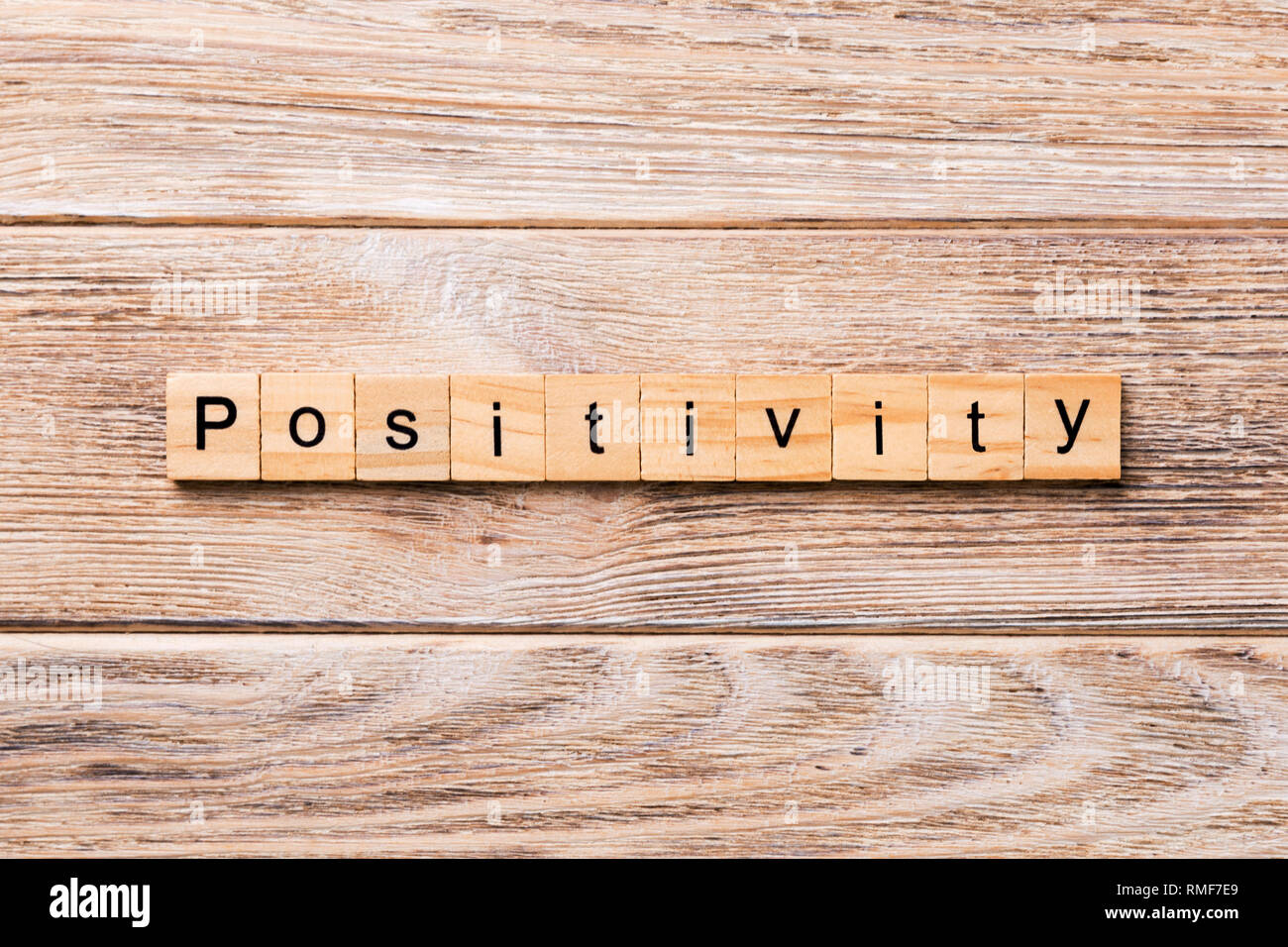 positivity word written on wood block. positivity text on wooden table for your desing, concept. Stock Photo