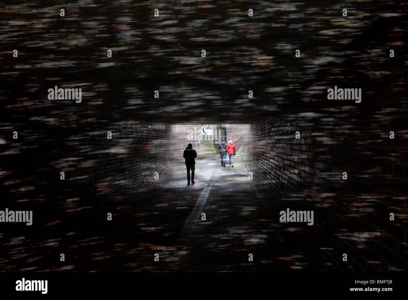 Walking in a dark tunnel, Germany Stock Photo